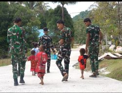 Senyum Anak-Anak Warnai Hasil Pembangunan Jalan Cor 250 Meter TMMD Ke-129 di Kampung Sesor
